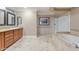 Luxurious bathroom featuring double sink vanity, custom-tiled shower and soaking tub at 9686 W Keyser Dr, Peoria, AZ 85383