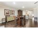 Traditional dining room with hardwood floors, modern lighting, and custom decorative touches at 9686 W Keyser Dr, Peoria, AZ 85383