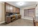 Spacious home office features custom built-ins, dual workstations, and plenty of natural light at 9686 W Keyser Dr, Peoria, AZ 85383