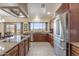 Bright kitchen features stainless steel appliances, granite countertops, and a scenic view from the sink window at 9686 W Keyser Dr, Peoria, AZ 85383