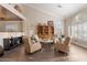 Bright living room features a vaulted ceiling, built-in bookcase, and comfortable seating area for relaxing at 9686 W Keyser Dr, Peoria, AZ 85383