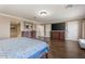 Comfortable main bedroom featuring hardwood floors, closet space and a great view of the bathroom at 9686 W Keyser Dr, Peoria, AZ 85383