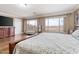 Bright main bedroom featuring hardwood floors, and oversized windows with a beautiful desert view at 9686 W Keyser Dr, Peoria, AZ 85383