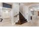 Inviting staircase features hardwood steps and a decorative tile design at 9686 W Keyser Dr, Peoria, AZ 85383