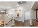 Upstairs hallway with modern lighting, hardwood floors, and a decorative wall niche at 9686 W Keyser Dr, Peoria, AZ 85383