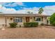 Charming single-story home with desert landscaping and unique architectural details at 9918 W Willow Creek Cir, Sun City, AZ 85373