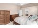 Well-lit primary bedroom featuring wood furniture and a neutral color palette at 9948 N 94Th Ave, Peoria, AZ 85345