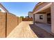 Unfurnished backyard featuring a block wall, covered patio, and view of neighboring home at 11605 W Green Dr, Youngtown, AZ 85363