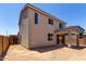 Two-story home exterior featuring a covered patio and unfurnished backyard at 11605 W Green Dr, Youngtown, AZ 85363