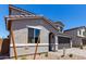 Exterior view of a two story home with desert landscaping and a two car garage at 11605 W Green Dr, Youngtown, AZ 85363