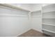 Spacious walk-in closet with shelving and clothing rods for organization at 11605 W Green Dr, Youngtown, AZ 85363