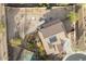 This aerial view showcases the spacious lot with a backyard that includes a full garden, a fire pit, and a covered patio at 13346 W Jesse Red Dr, Peoria, AZ 85383