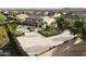 Expansive backyard featuring outdoor kitchen, dining area, lounge space, garden, and large paved area at 13346 W Jesse Red Dr, Peoria, AZ 85383