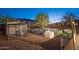 The peaceful backyard features a lush garden with raised garden beds and string lighting at 13346 W Jesse Red Dr, Peoria, AZ 85383