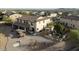 Aerial view of a backyard featuring gravel, pavers, outdoor bar, metal planters, and seating at 13346 W Jesse Red Dr, Peoria, AZ 85383