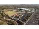 Aerial view shows an expansive neighborhood park with covered playground, walking trails, and large green space at 13346 W Jesse Red Dr, Peoria, AZ 85383