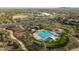 An aerial view of the community pool shows a fun aquatic center surrounded by walking paths and amenities at 13346 W Jesse Red Dr, Peoria, AZ 85383