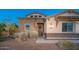 Charming single-story home with stone accents, lush landscaping and a welcoming front entrance at 13346 W Jesse Red Dr, Peoria, AZ 85383