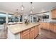 Spacious kitchen features large island with granite countertop and breakfast bar seating at 13346 W Jesse Red Dr, Peoria, AZ 85383