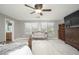 Comfortable main bedroom with neutral colors, ceiling fan, and ample natural light at 13346 W Jesse Red Dr, Peoria, AZ 85383