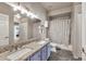 Bathroom featuring double sinks, granite countertops, and a shower-tub combination with tile floors at 15380 N 100Th St # 2098, Scottsdale, AZ 85260