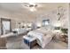 Bedroom featuring decorative wall, plush carpeting, and a mirrored closet door at 15380 N 100Th St # 2098, Scottsdale, AZ 85260