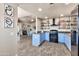 Inviting kitchen with blue cabinets, granite countertops, and open shelving at 15380 N 100Th St # 2098, Scottsdale, AZ 85260