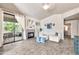 Elegant living room featuring fireplace, sliding glass doors to patio, and an open layout at 15380 N 100Th St # 2098, Scottsdale, AZ 85260