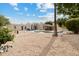 Exterior backyard showcases a pool, patio, tiki bar, and outdoor seating, perfect for relaxing and entertaining at 15440 E Mustang Dr, Fountain Hills, AZ 85268