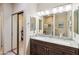 Modern bathroom featuring a double vanity, granite countertops, and a glass-enclosed shower at 15440 E Mustang Dr, Fountain Hills, AZ 85268