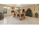 Bright dining room featuring a decorative fireplace, rustic furniture and tile flooring at 15440 E Mustang Dr, Fountain Hills, AZ 85268