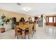 Spacious dining room with elegant table and chairs, bright lighting, and tile flooring at 15440 E Mustang Dr, Fountain Hills, AZ 85268