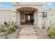 Inviting home entrance featuring a bench, cactus plants, and desert landscaping at 15440 E Mustang Dr, Fountain Hills, AZ 85268