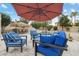 Poolside patio with comfortable seating and an umbrella, perfect for relaxation at 15440 E Mustang Dr, Fountain Hills, AZ 85268