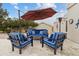 Comfortable outdoor seating with a table under an umbrella with the house in the background at 15440 E Mustang Dr, Fountain Hills, AZ 85268