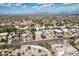 A wide aerial view shows the property's location within a residential neighborhood with mountain views in the distance at 15510 E Sycamore Dr, Fountain Hills, AZ 85268