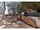 Back yard with an outdoor kitchen, a barbecue, and a comfortable seating area at 15510 E Sycamore Dr, Fountain Hills, AZ 85268