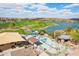 Scenic aerial view of the community park with a playground, lake, and walking path with mountain views in the background at 15510 E Sycamore Dr, Fountain Hills, AZ 85268