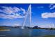 Beautiful view of a lake with a fountain and birdlife, with mountains and blue skies in the background at 15510 E Sycamore Dr, Fountain Hills, AZ 85268