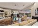 Stylish living room featuring hardwood floors, a comfortable sofa, and expansive windows with scenic views at 15510 E Sycamore Dr, Fountain Hills, AZ 85268