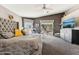 Spacious main bedroom with a gray color scheme, ceiling fan, and outdoor access at 15510 E Sycamore Dr, Fountain Hills, AZ 85268