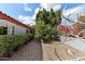 Landscaped side yard with lush greenery and a private walkway to the front of the house at 15510 E Sycamore Dr, Fountain Hills, AZ 85268