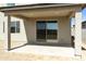 Covered patio with sliding glass doors that seamlessly connect the indoor and outdoor living areas at 15675 W Mercer Ln, Surprise, AZ 85379