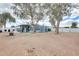 Spacious backyard with shed and mature trees at 1669 N Suncrest Ave, Casa Grande, AZ 85122