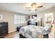 Cozy bedroom with neutral tones, a ceiling fan, and ample storage, creating a relaxing atmosphere at 1669 N Suncrest Ave, Casa Grande, AZ 85122