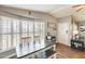 Bright dining area with large windows and modern furnishings, creating a comfortable space for gatherings at 1669 N Suncrest Ave, Casa Grande, AZ 85122