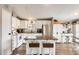 Kitchen with island, bar stool seating, white cabinetry, and stainless steel appliances at 1669 N Suncrest Ave, Casa Grande, AZ 85122