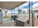 The outdoor patio features a storage box and two barbecues for entertaining at 1669 N Suncrest Ave, Casa Grande, AZ 85122