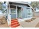 The front porch is shown, with an American flag attached to the siding at 1669 N Suncrest Ave, Casa Grande, AZ 85122