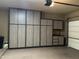 Spacious garage featuring modern storage cabinets for organization and convenience at 1708 W Dusty Wren Dr, Phoenix, AZ 85085